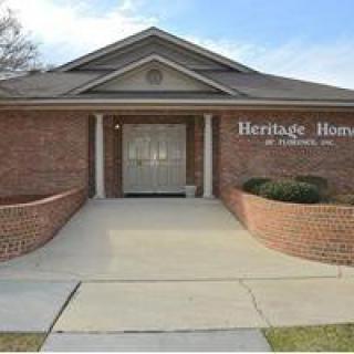 A brick building entrance labeled 'Heritage Home'.