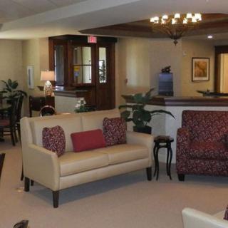 A cozy living room with stylish furniture and warm lighting.