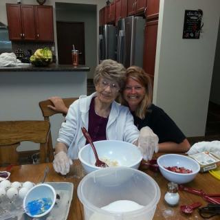 Two people enjoying baking together in the kitchen.