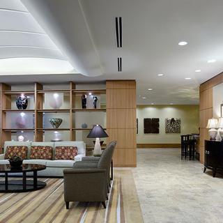 A modern lobby area featuring comfortable seating, stylish decor, and ambient lighting.