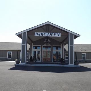 A church entrance with a welcoming sign.