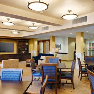 A well-lit lounge area with comfortable seating and modern decor.