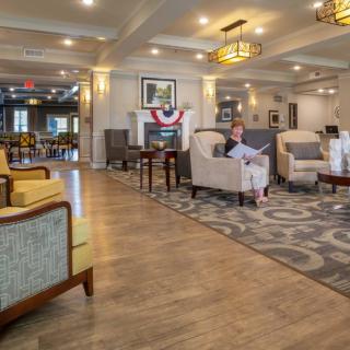 A spacious and elegantly designed lobby with comfortable seating and warm lighting.