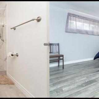 A modern interior showcasing a bathroom and an adjacent bedroom with hardwood flooring.