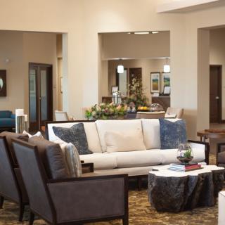 A stylish and cozy living room with comfortable seating and tasteful decor.