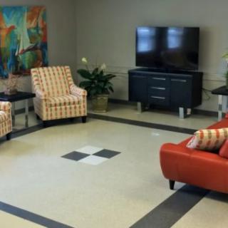 A modern living room with comfortable seating and a television.