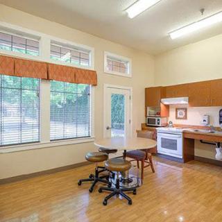 A spacious kitchen area with modern appliances and natural lighting.