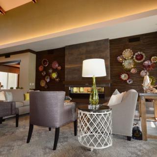 A modern living room with stylish decor and comfortable seating.