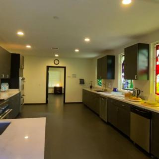 A modern, spacious kitchen with ample countertop space and bright lighting.