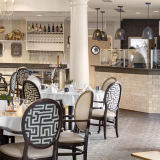 An elegant restaurant interior with stylish decor and neatly arranged dining tables.