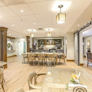 A modern dining area with a spacious kitchen and stylish decor.