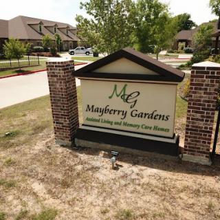 Entrance sign of Mayberry Gardens, a residential living community.
