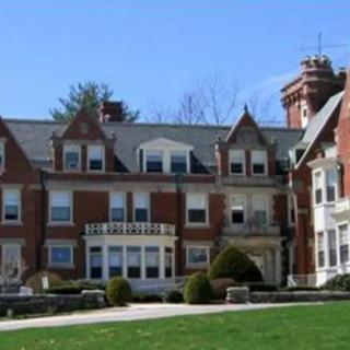 A historic mansion with intricate architectural details.