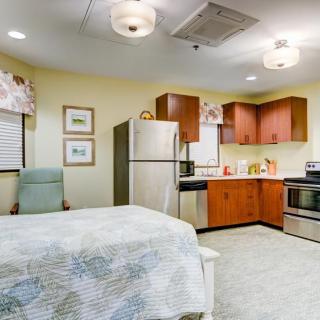 Cozy apartment interior featuring a combined kitchen and bedroom area.