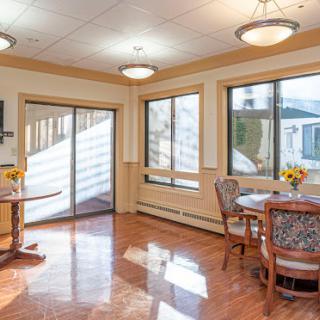 A bright and inviting dining area with large windows providing ample natural light.