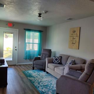 A cozy living room with comfortable seating and decorative accents.
