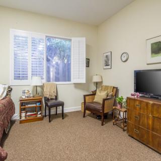 A cozy living room with comfortable seating and a television.