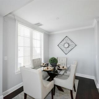 A modern dining room with a neutral color palette and stylish decor.