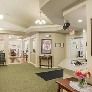 A welcoming reception area with comfortable seating and floral decorations.