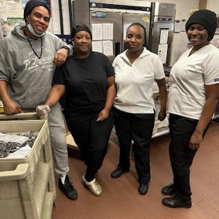 A dedicated team of kitchen staff working together to serve delicious meals.