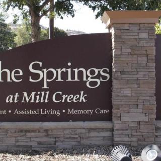 Entrance sign for The Springs at Mill Creek, a community offering independent and assisted living as well as memory care.