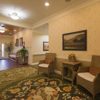 A cozy lobby with seating and decorative elements.