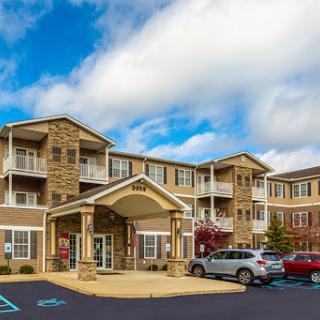 A modern residential building featuring multiple apartments and a welcoming entrance.
