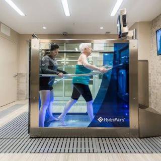 A person using an underwater treadmill for rehabilitation and exercise.