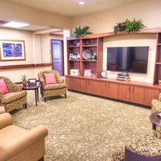 A cozy living room with comfortable seating and a television.