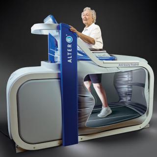 An elderly person enjoying a workout on a specialized treadmill designed for rehabilitation and fitness.