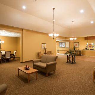 A spacious and inviting lobby area featuring comfortable seating and warm lighting.