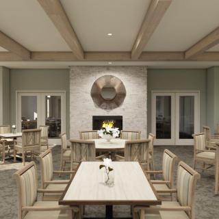 A modern dining room featuring elegant furniture and a cozy fireplace.