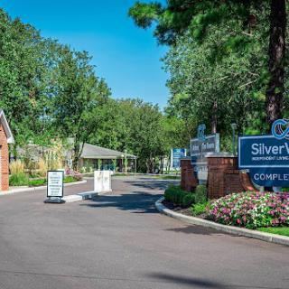 The welcoming entrance to Silverwood community, surrounded by lush greenery.