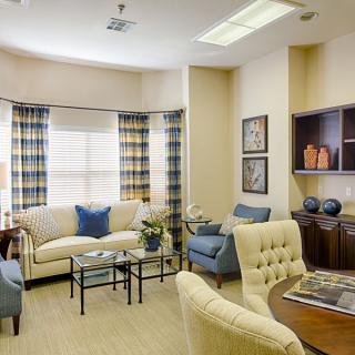 A cozy and elegantly designed living room with comfortable seating and tasteful decor.