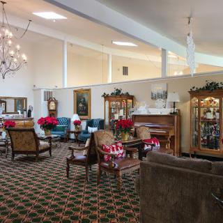 A beautifully decorated living room featuring elegant furniture and a cozy seating arrangement.