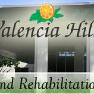 Entrance sign for Valencia Hills and Rehabilitation.