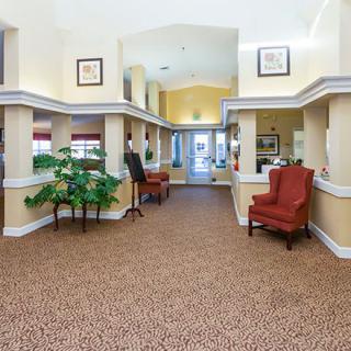 A well-lit lobby area with comfortable seating and decorative elements.