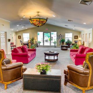 A spacious living room with comfortable seating and elegant decor.