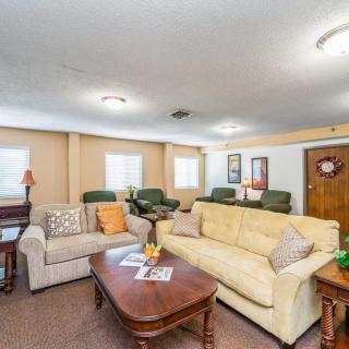 A cozy living room with sofas and a coffee table.