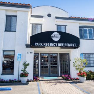 The entrance to Park Regency Retirement Home, featuring a welcoming facade and clear signage.