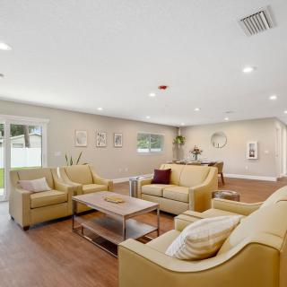 A spacious living room with comfortable seating and neutral decor.