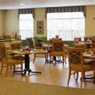 Cozy dining area with neatly arranged tables and chairs.