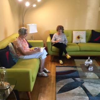 Two people relaxing in a cozy living room.