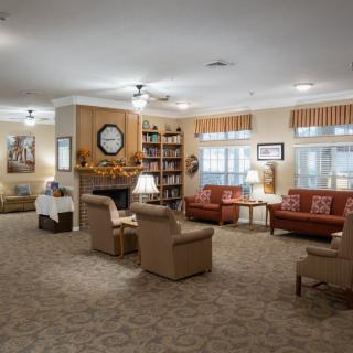 Cozy living room with comfortable seating and a fireplace.