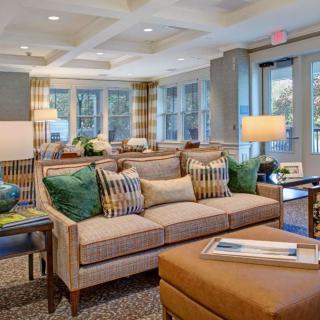 A beautifully decorated living room with comfortable seating and warm lighting.