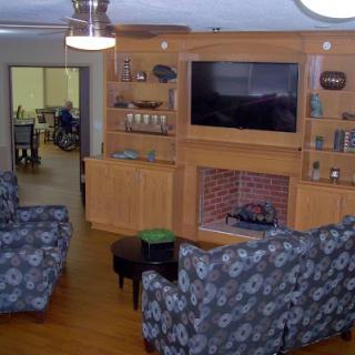 A cozy living room featuring comfortable seating and a television.