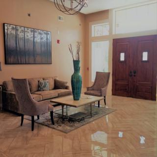 A stylish living room with modern furniture and elegant decor.