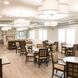 A modern dining area with elegant lighting and stylish furnishings.