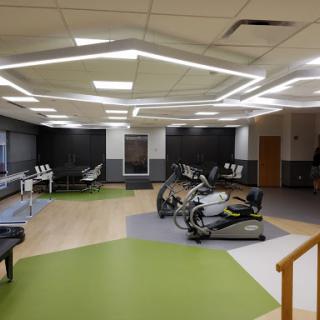 A modern fitness studio featuring exercise bikes and a sleek, contemporary design.