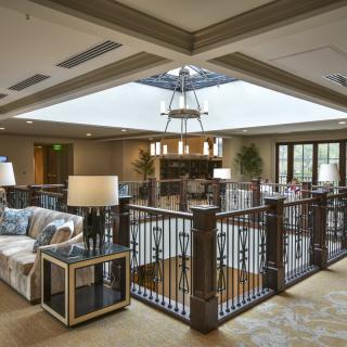 A cozy lobby interior with stylish furniture and natural lighting.